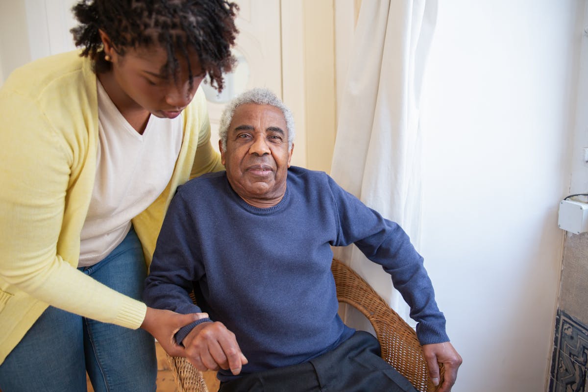 Caregiver helping elderly person